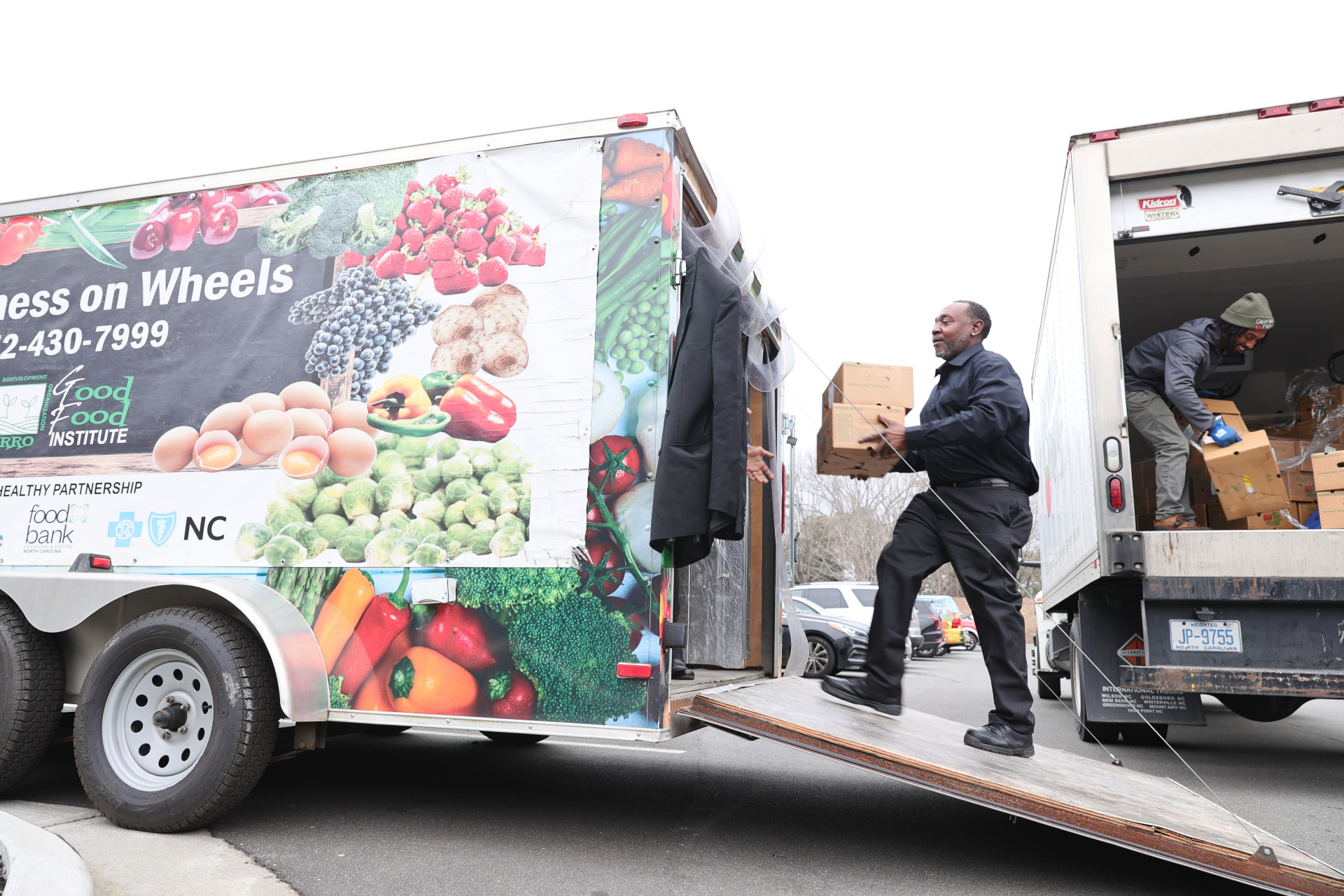 Food delivery truck being loaded with groceries